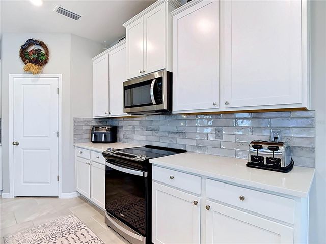 7677 BROAD RIVER AVENUE, Land O Lakes, FL 34638