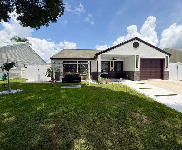 7743 Elwood Drive, Greenacres, FL 33467