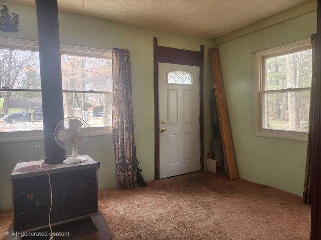 1306 Russell Drive, Harrison, MI 48625