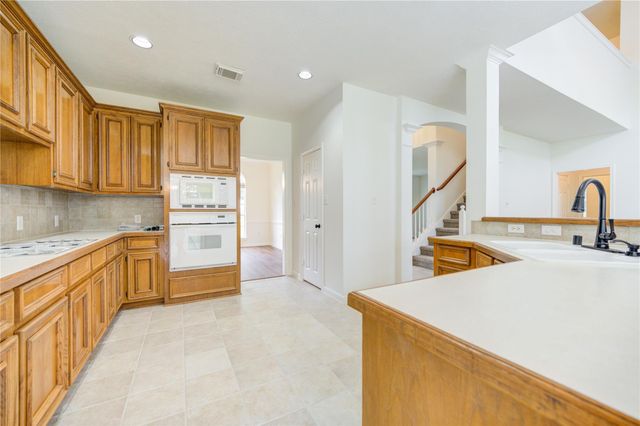 7110 Rustling Oaks Drive, Richmond, TX 77469