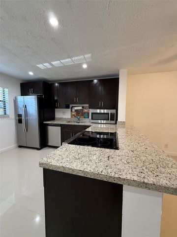6095 N Sabal Palm Boulevard 103, Tamarac, FL 33319