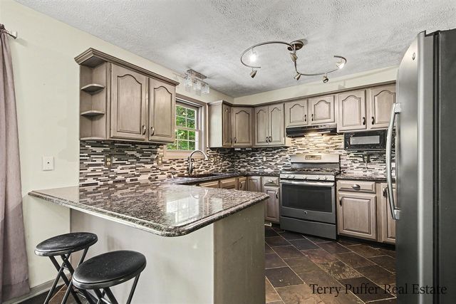 12080 Pine Cone Drive, Rockford, MI 49341