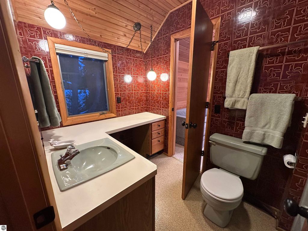 Image 24 of property listing at 7780 Elk Tip Drive, Rapid City, MI 49676