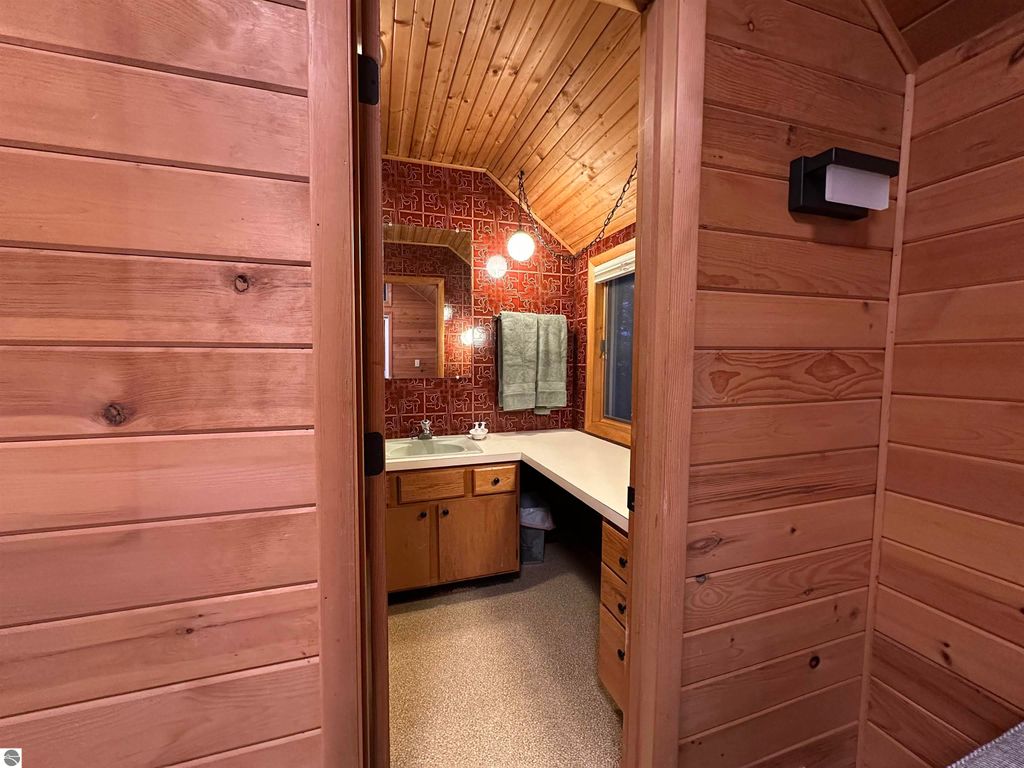 Image 25 of property listing at 7780 Elk Tip Drive, Rapid City, MI 49676