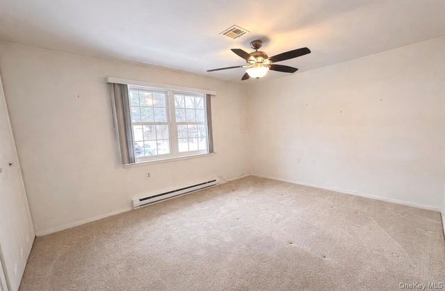 306 Torquay Court E, Ridge, NY 11961