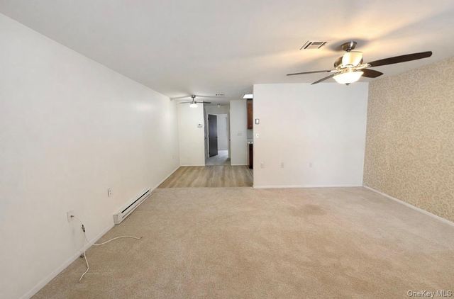 306 Torquay Court E, Ridge, NY 11961