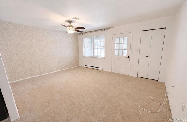 306 Torquay Court E, Ridge, NY 11961