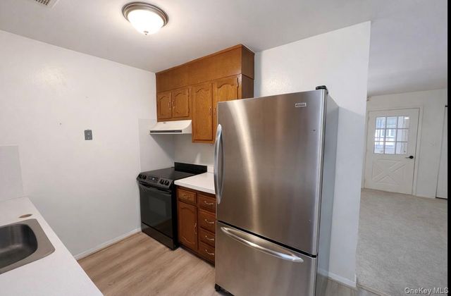 306 Torquay Court E, Ridge, NY 11961