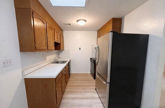 306 Torquay Court E, Ridge, NY 11961