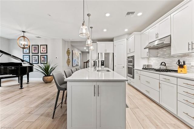 7763 Winding Cypress DR, Naples, FL 34114