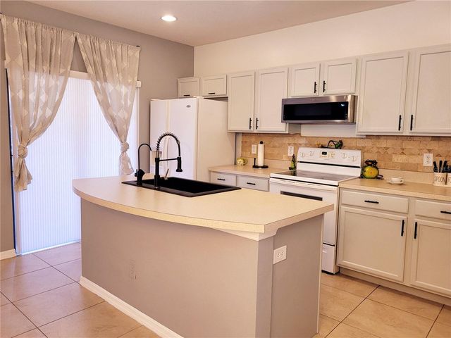 1018 TULLAMORE DRIVE, Wesley Chapel, FL 33543