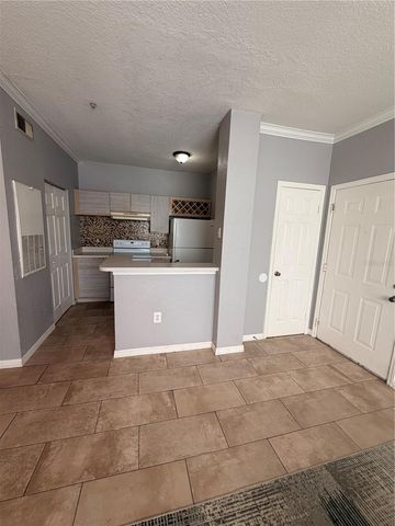 2674 ROBERT TRENT JONES DRIVE 323, Orlando, FL 32835