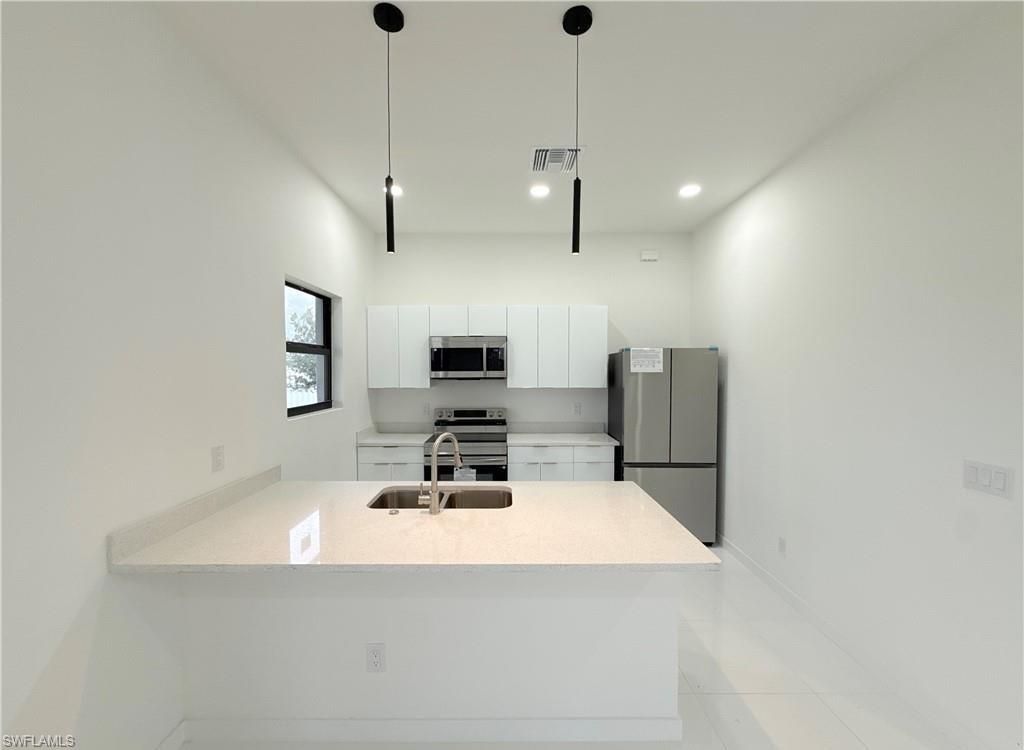 Image 10 of property listing at 2418 NW 25th ST, Cape Coral, FL 33993