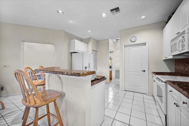 180 Egret Circle, Greenacres, FL 33413