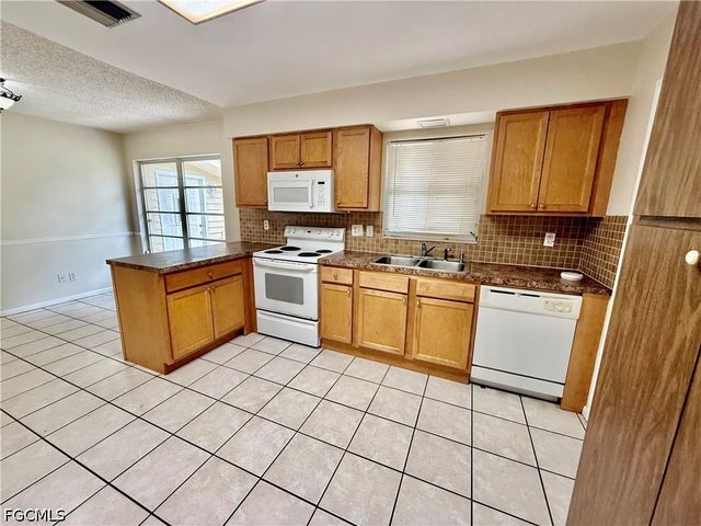 706 E 3rd ST, Lehigh Acres, FL 33936