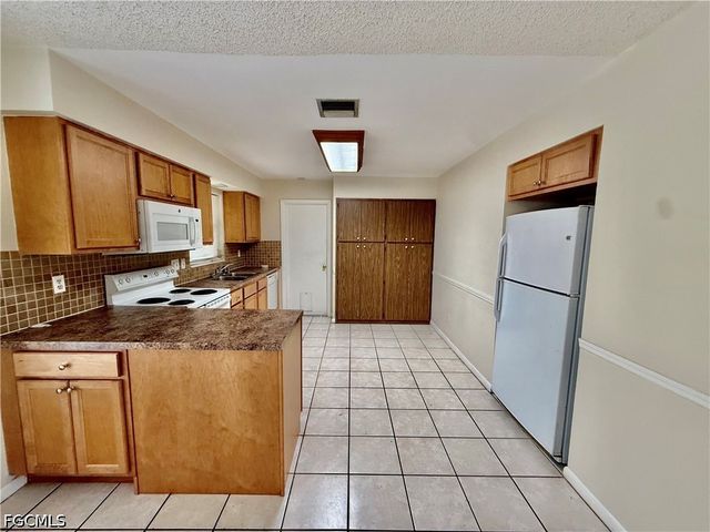 706 E 3rd ST, Lehigh Acres, FL 33936