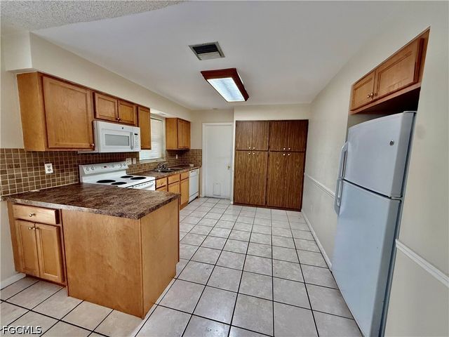 706 E 3rd ST, Lehigh Acres, FL 33936
