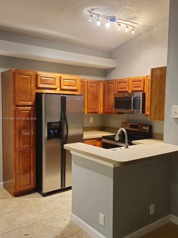 701 Lyons Rd 13205, Coconut Creek, FL 33063