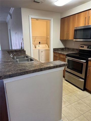 5840 W Sample Road 306, Coral Springs, FL 33067