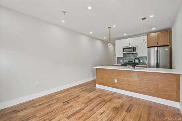 6037 Wetherole Street, Rego Park, NY 11373