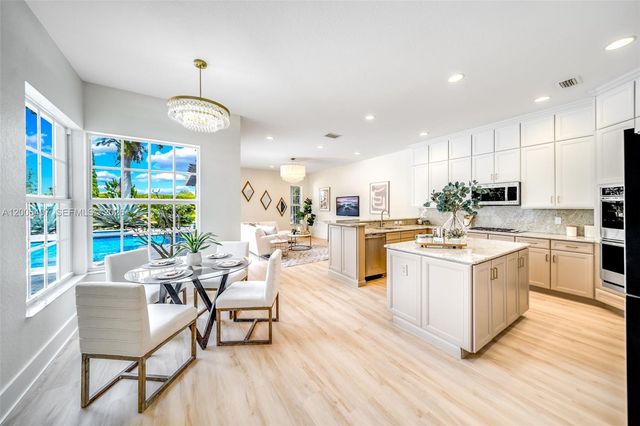 8766 Miralago Way, Parkland, FL 33076