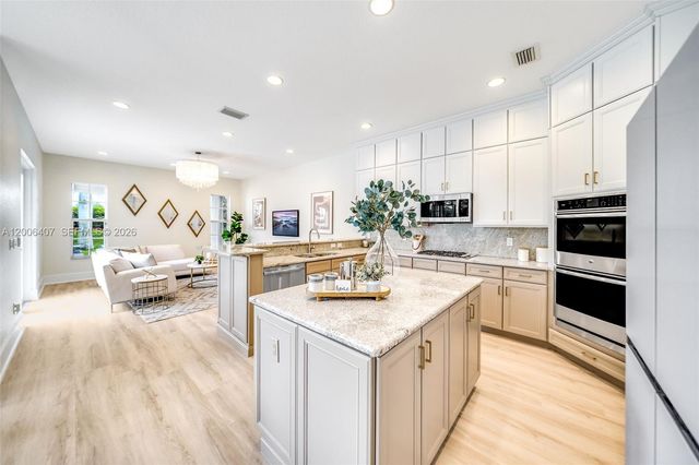 8766 Miralago Way, Parkland, FL 33076