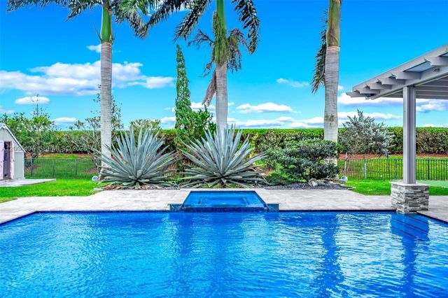 8766 Miralago Way, Parkland, FL 33076