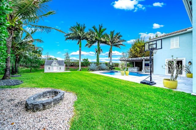 8766 Miralago Way, Parkland, FL 33076