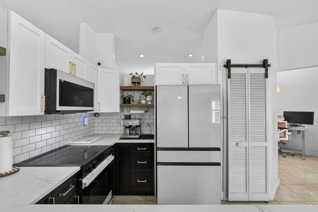 102 E Royal Pine Cir Court, Royal Palm Beach, FL 33411