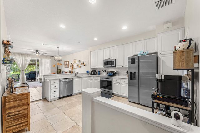 1094 Pinewood Lake Court, Greenacres, FL 33415