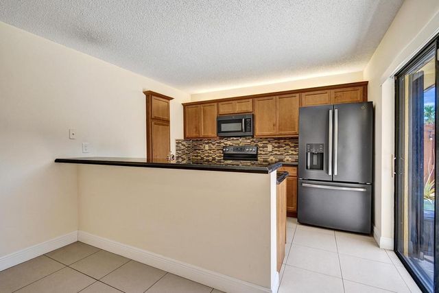 973 Springdale Circle 97-C, Palm Springs, FL 33461