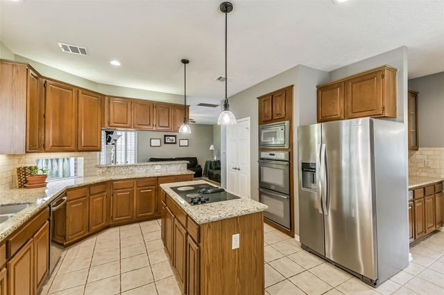 5002 Natural Bridge Drive, Kingwood, TX 77345