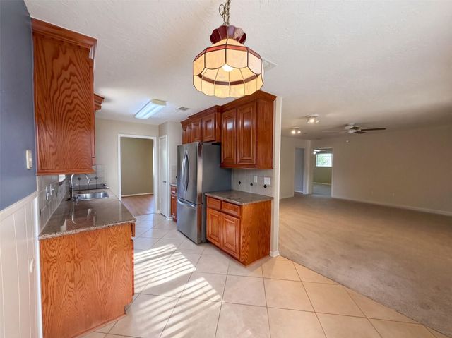 11819 Amblewood Drive, Meadows Place, TX 77477