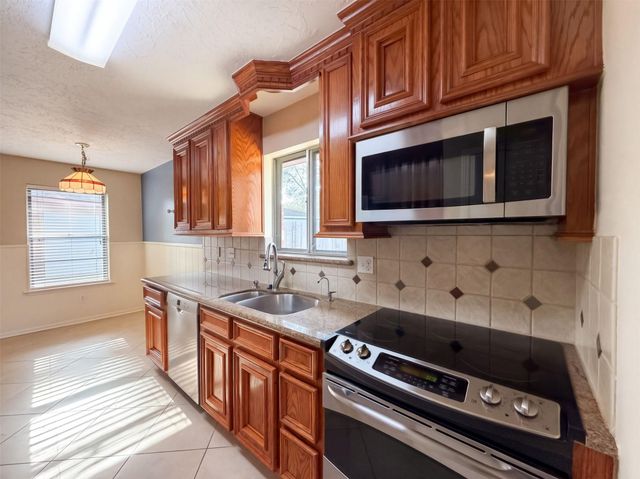 11819 Amblewood Drive, Meadows Place, TX 77477