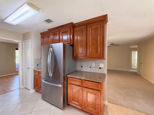 11819 Amblewood Drive, Meadows Place, TX 77477