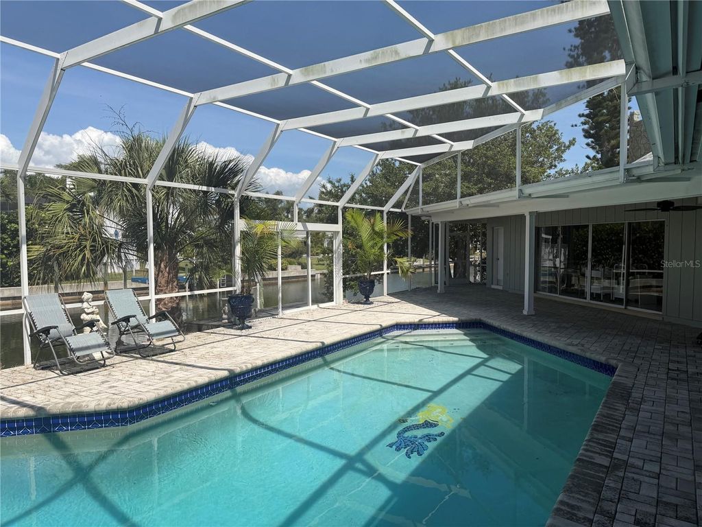 Image 34 of property listing at 6937 MIDNIGHT PASS ROAD, Sarasota, FL 34242