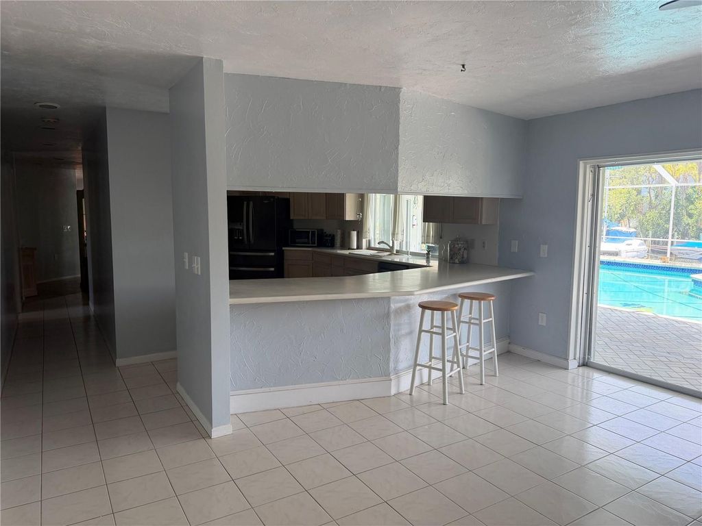 Image 42 of property listing at 6937 MIDNIGHT PASS ROAD, Sarasota, FL 34242