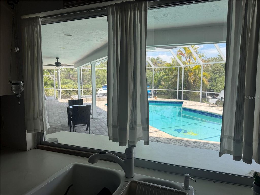 Image 46 of property listing at 6937 MIDNIGHT PASS ROAD, Sarasota, FL 34242