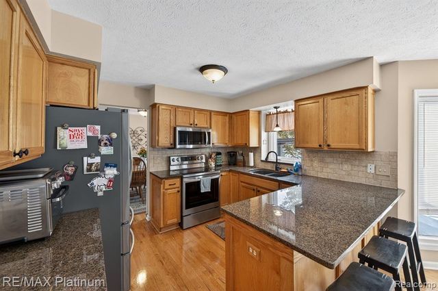 1408 Morning Mist Drive, Howell, MI 48843