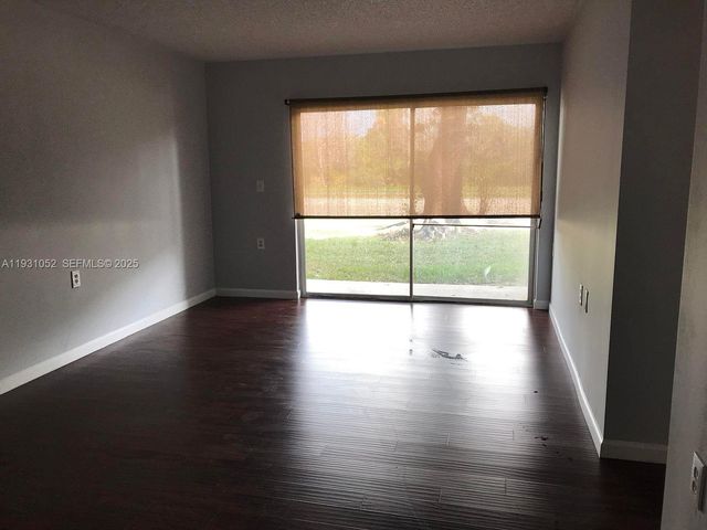 1133 N Benoist Farms Rd 103, West Palm Beach, FL 33411