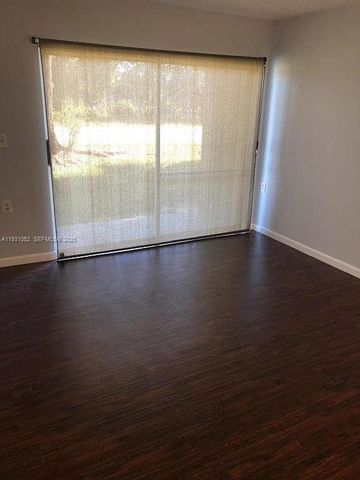 1133 N Benoist Farms Rd 103, West Palm Beach, FL 33411