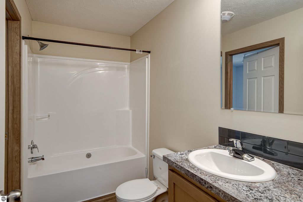 Image 26 of property listing at 303 Westwood Road, Nw, Alden, MI 49612