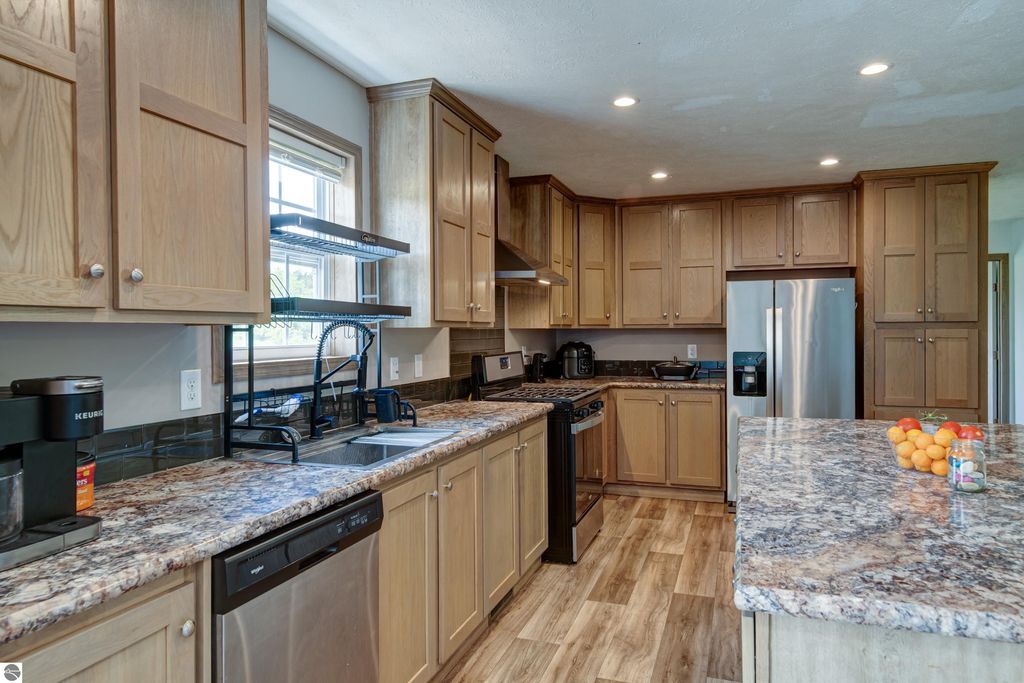 Image 7 of property listing at 303 Westwood Road, Nw, Alden, MI 49612