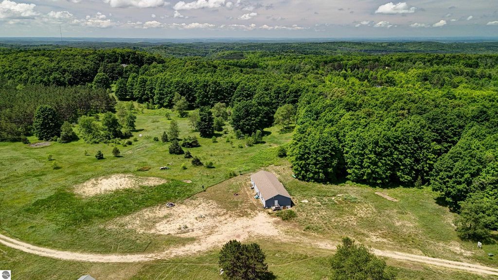 Image 78 of property listing at 303 Westwood Road, Nw, Alden, MI 49612