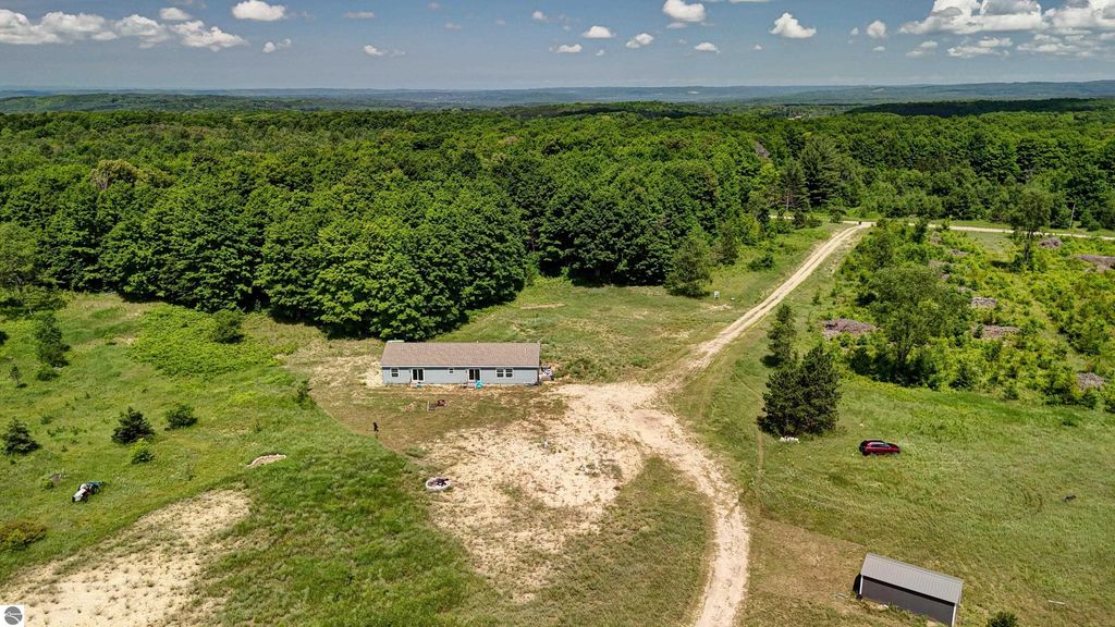 Image 80 of property listing at 303 Westwood Road, Nw, Alden, MI 49612