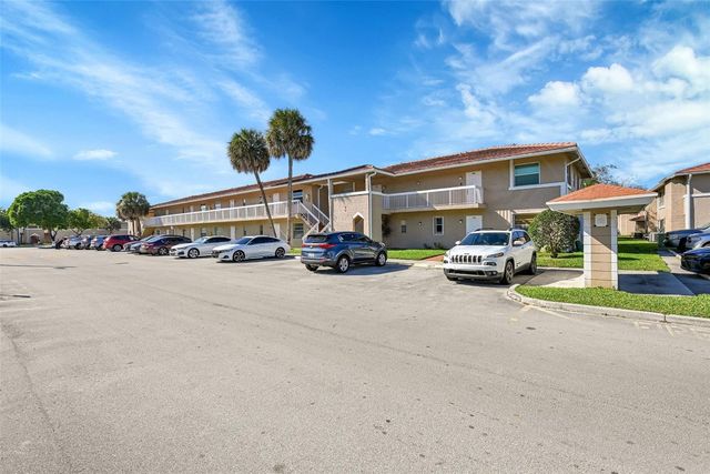 906 Twin Lakes Drive 8-J, Coral Springs, FL 33071