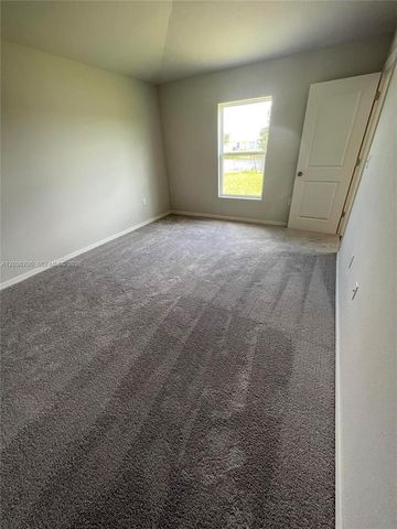 9114 Aegean Circle, Lehigh Acres, FL 33936