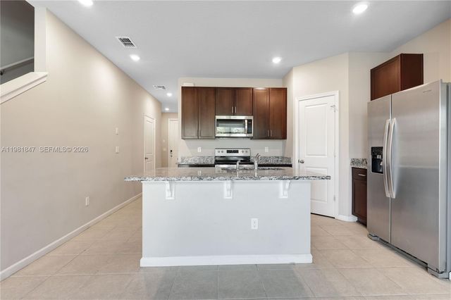 1761 Lindley St, Mangonia Park, FL 33407