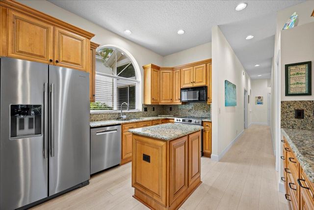 21 Grand Bay Circle, Juno Beach, FL 33408