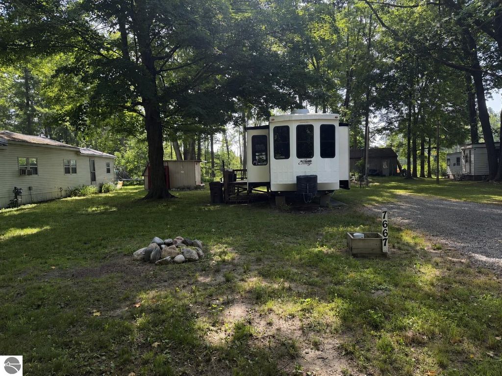 Image 1 of property listing at 7667 Windoga Lake Drive, Weidman, MI 48893